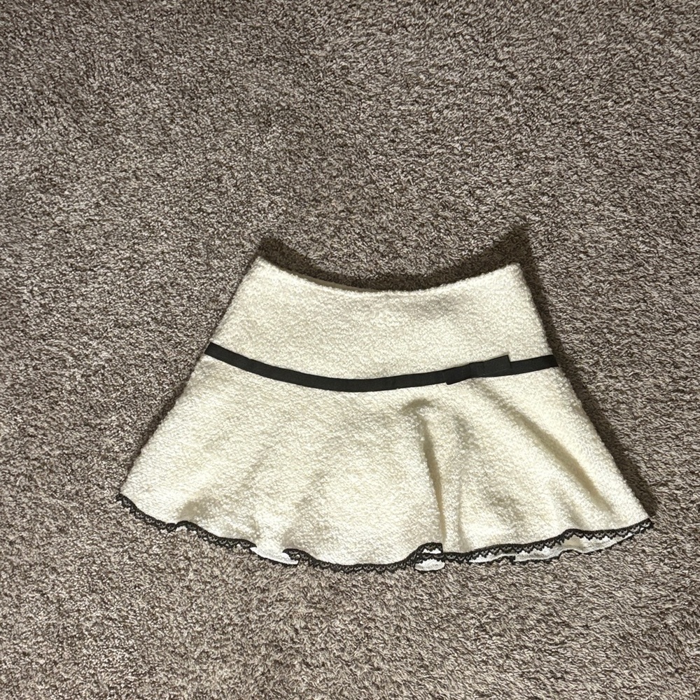 Elegant Cream Skirt with Black Trim